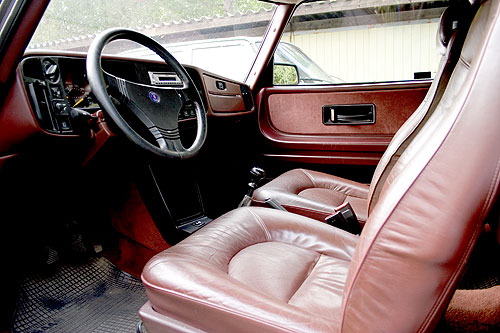 Leather steering wheel and Ox blood red leather seats. Even the dash is red!