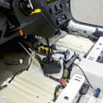 Work in progress: Interior wiring and componentry the customer will never see lies exposed on the assembly line. Work in progress: Interior wiring and componentry the customer will never see lies exposed on the assembly line.